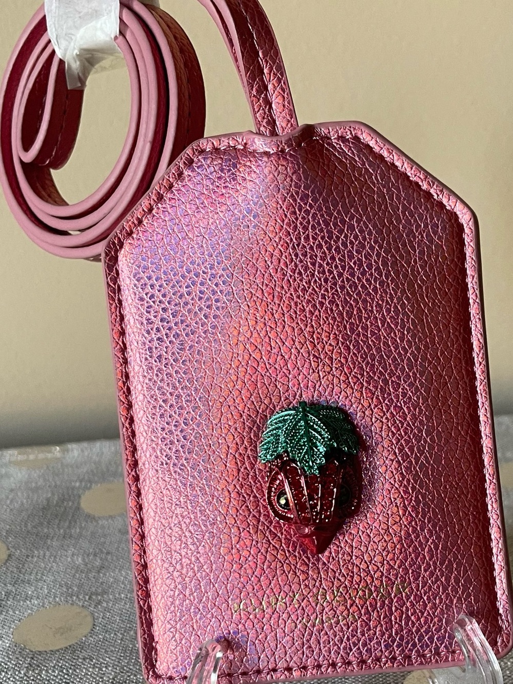 “Kurt Geiger London” 
Pink Metallic Leather Lanyard with Strawberry Head.